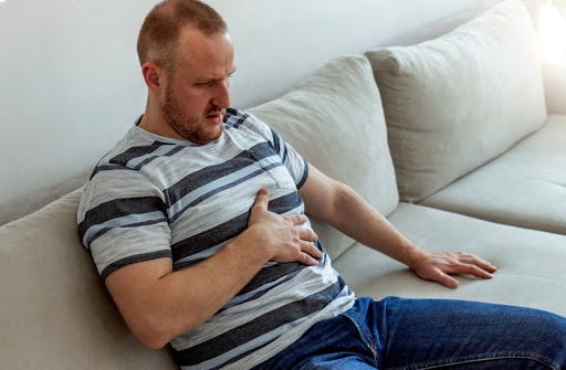Person Suffering From Acid Reflux